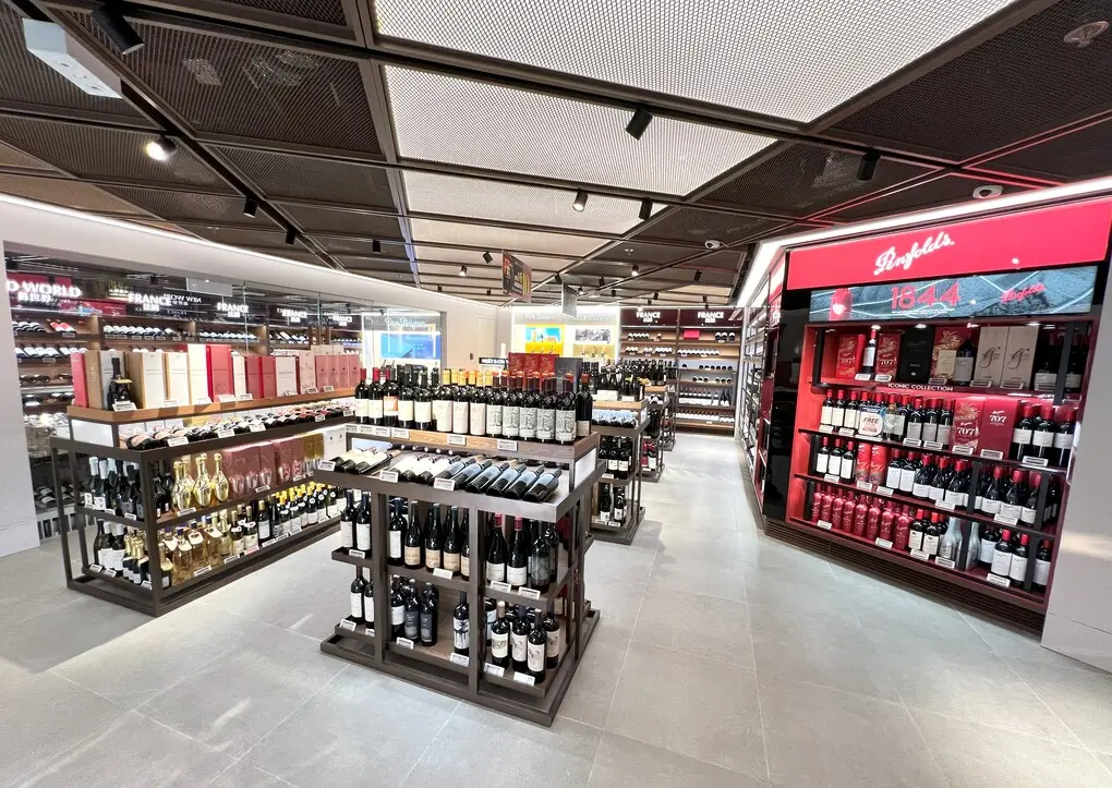 Liquor shelving and aisle merchandising view.