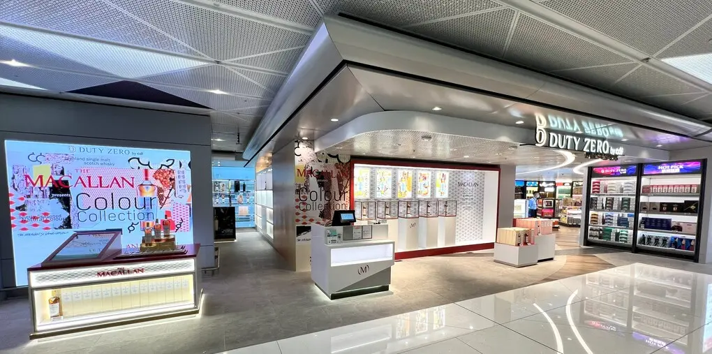 Shopfront and digital-screen application with blue campaign graphics.