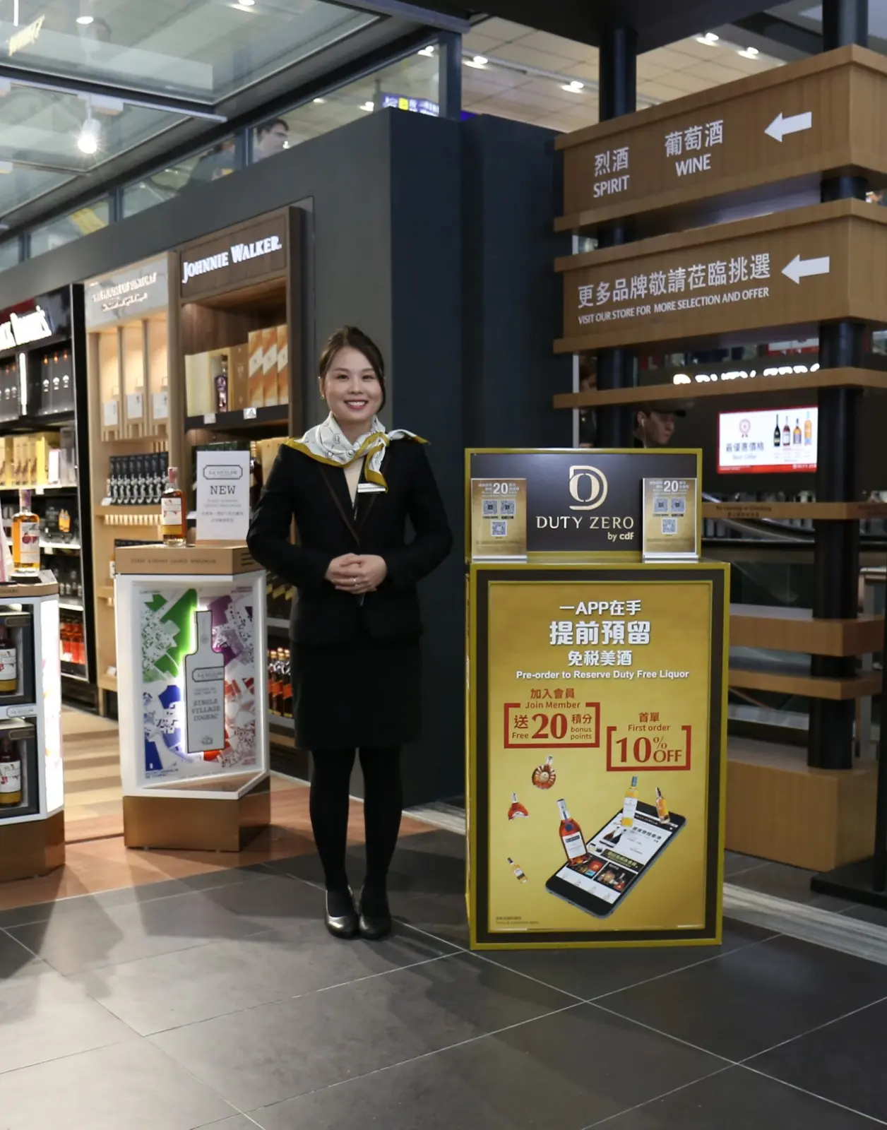 Store entrance with freestanding promotional display and wayfinding.