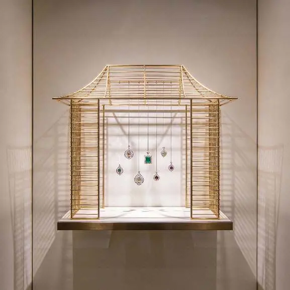 Gold pavilion-style jewellery display, frontal view.