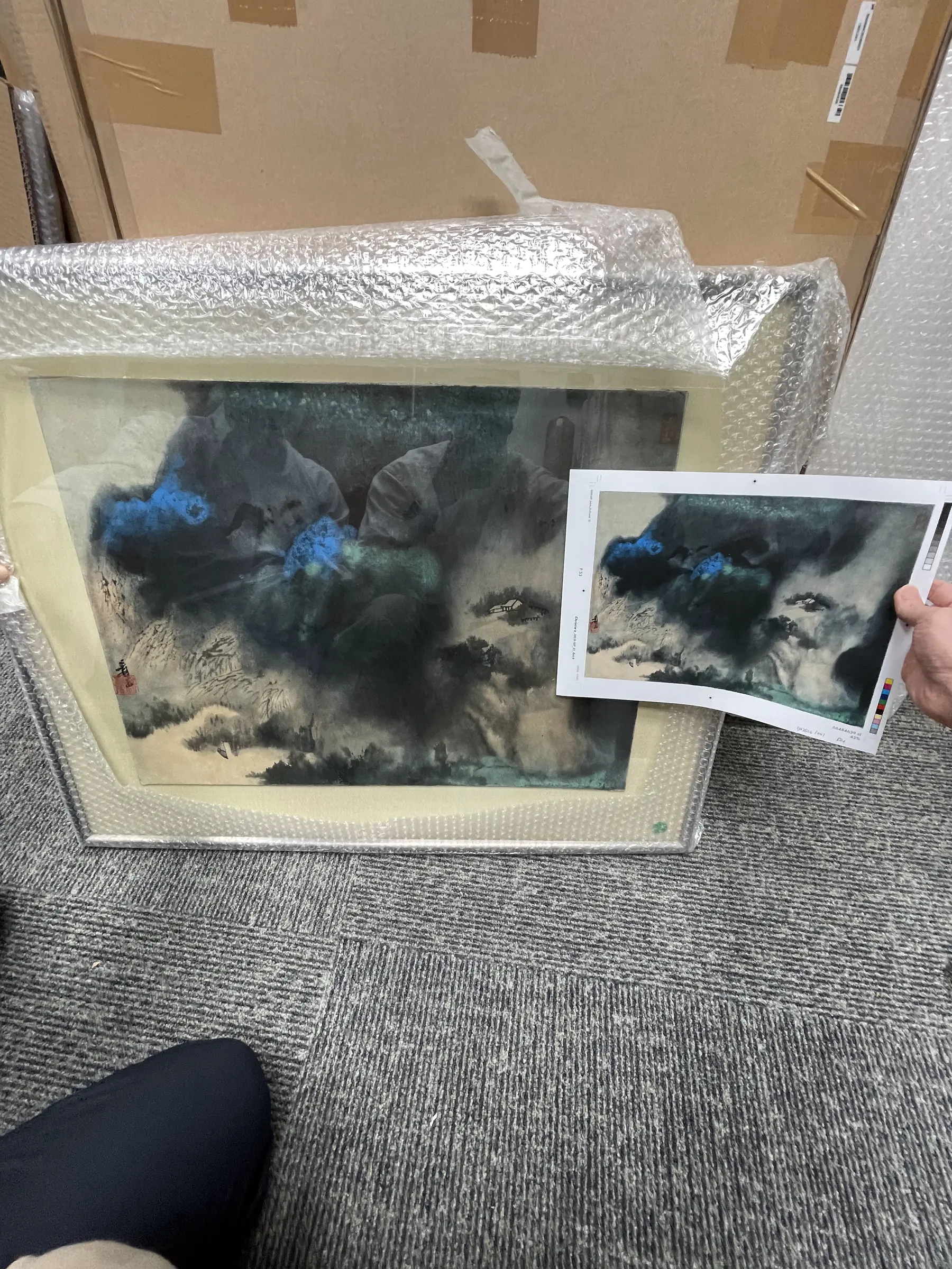 Physical artwork and printed reference compared side by side.