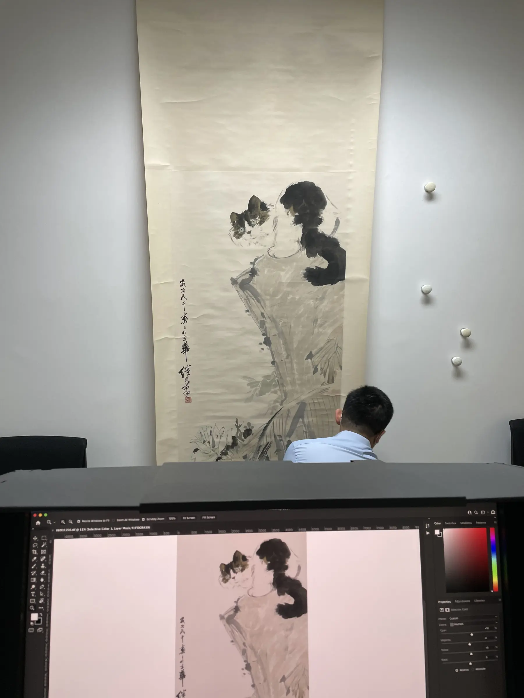 Hanging scroll and monitor viewed together.